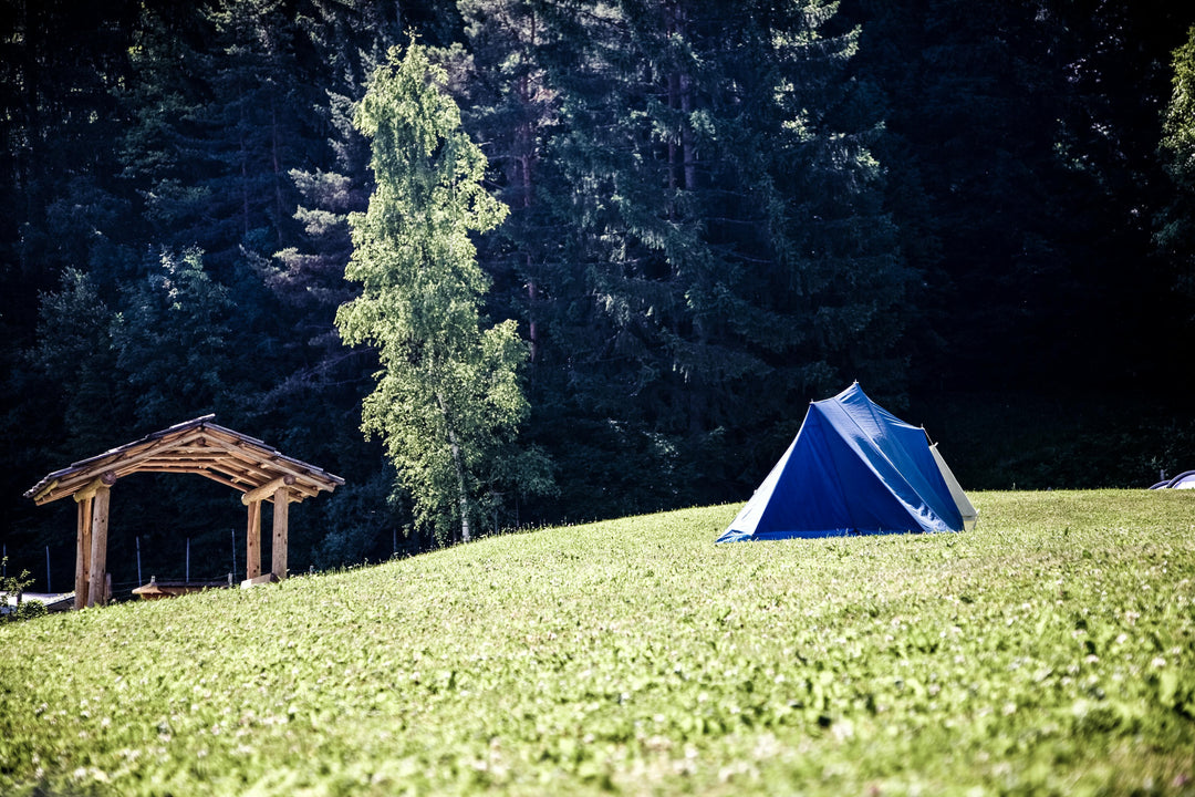 About Us 2 - tent in forest